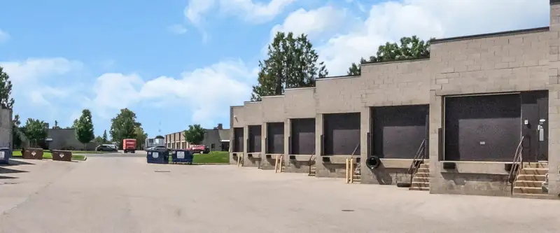 A row of dock doors along the lane of the industrial park in London, Ontario